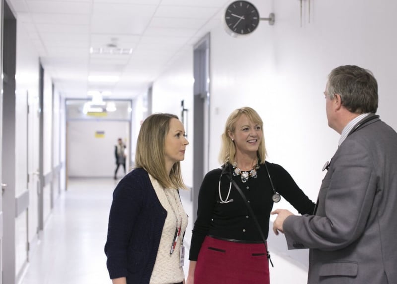 Group of doctors talking in hospital corridor